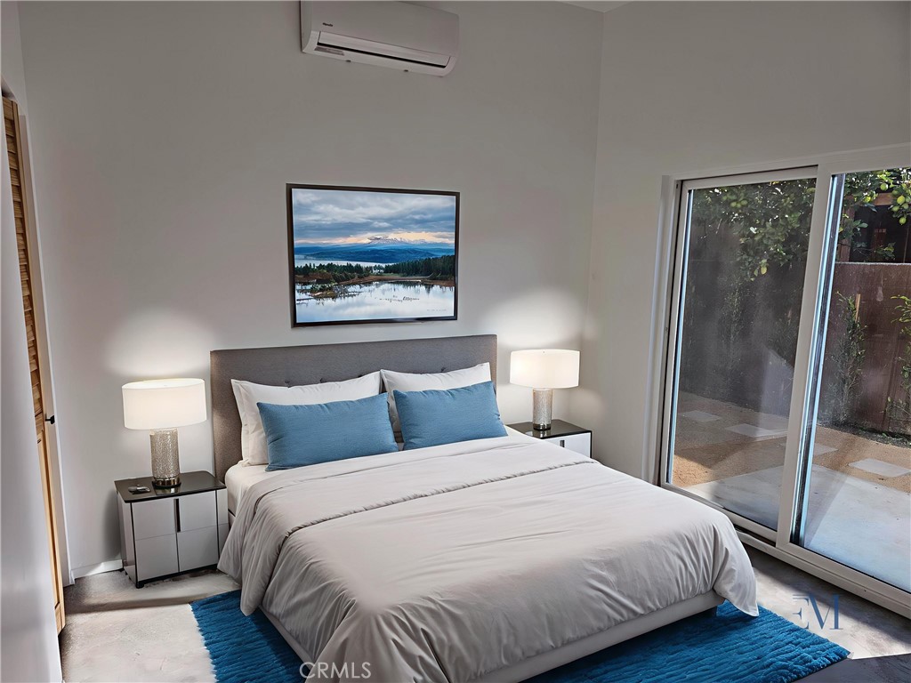 720 San Pascual Avenue Los Angeles, CA 90042 - Photo 12 of 20 a bedroom with a bed and wooden floor