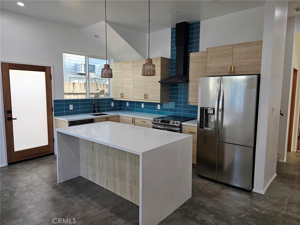 720 San Pascual Avenue Los Angeles, CA 90042 - Photo 5 of 20 a kitchen with stainless steel appliances a refrigerator a sink a stove a microwave and island