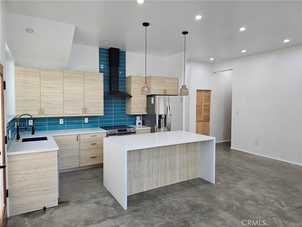 720 San Pascual Avenue Los Angeles, CA 90042 - Photo 6 of 20 a kitchen with kitchen island a sink stainless steel appliances and cabinets