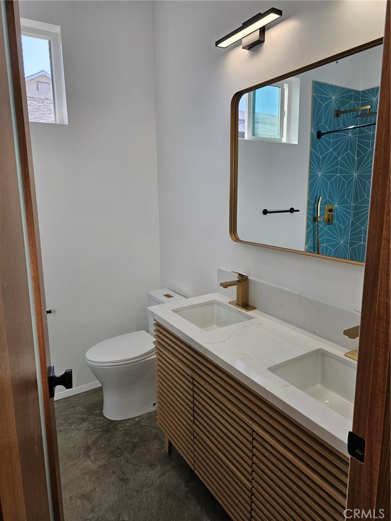 720 San Pascual Avenue Los Angeles, CA 90042 - Photo 10 of 20 a bathroom with a sink a toilet and mirror
