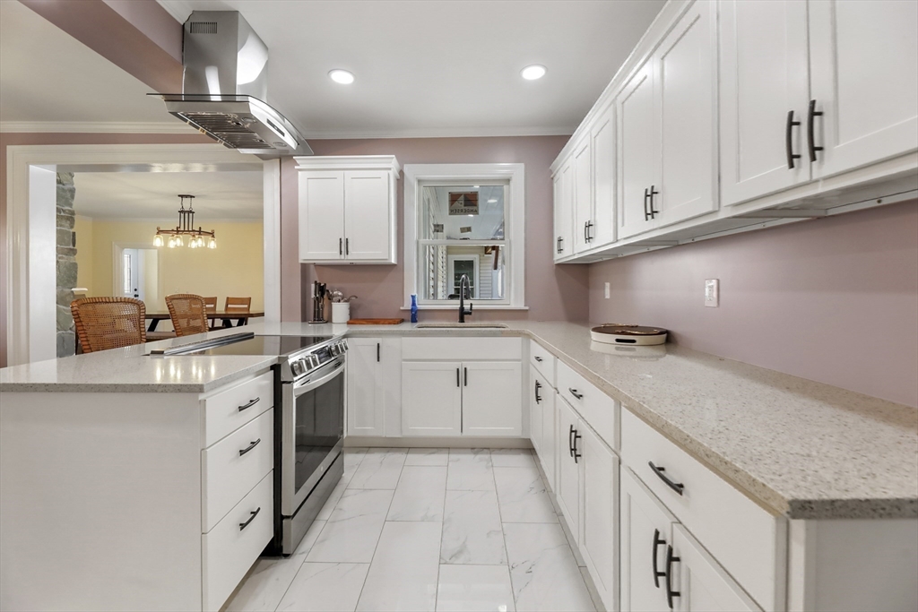 45 Forest Street Lee, MA 01238 - Photo 13 of 42 a kitchen with granite countertop white cabinets and white appliances