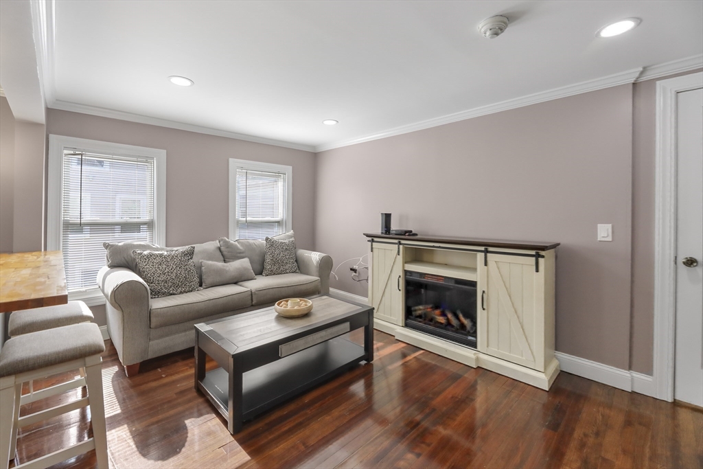 45 Forest Street Lee, MA 01238 - Photo 20 of 42 a living room with furniture and a fireplace
