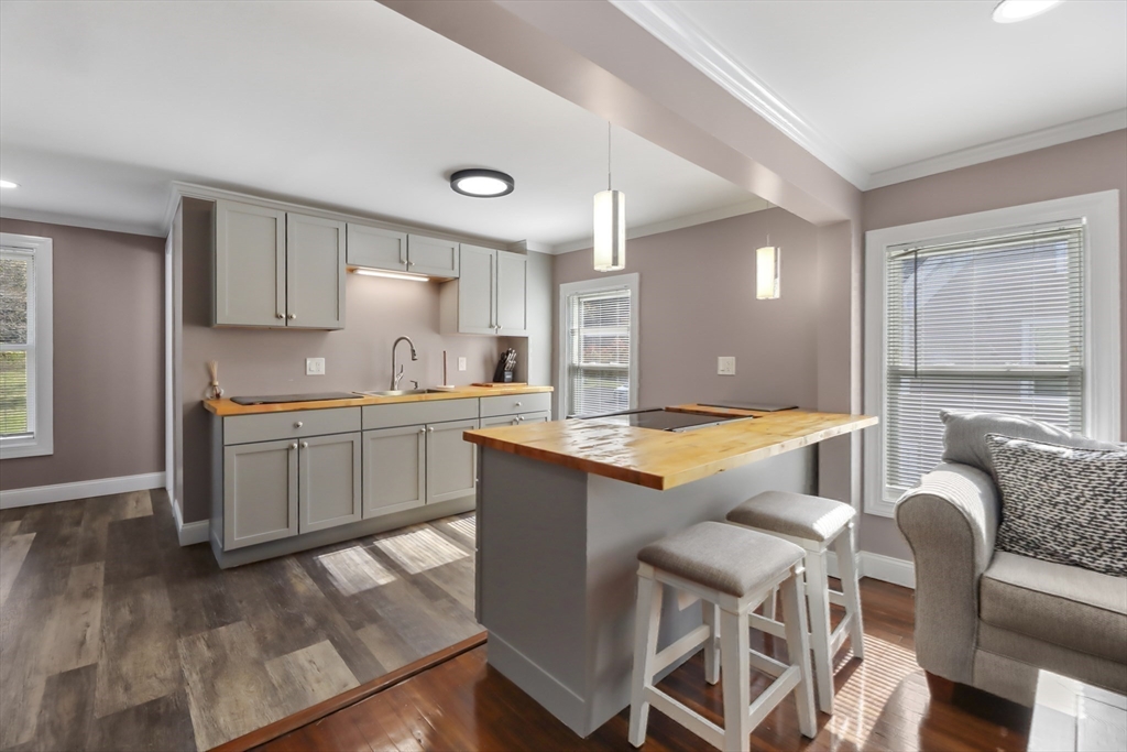 45 Forest Street Lee, MA 01238 - Photo 22 of 42 a kitchen with stainless steel appliances granite countertop a stove a sink and a refrigerator