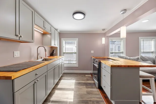 a kitchen with stainless steel appliances granite countertop a sink and cabinets