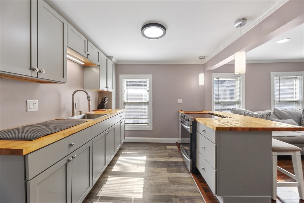 45 Forest Street Lee, MA 01238 - Photo 23 of 42 a kitchen with stainless steel appliances granite countertop a sink and cabinets