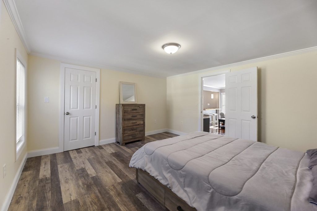 45 Forest Street Lee, MA 01238 - Photo 25 of 42 a bedroom with a bed and a cabinets