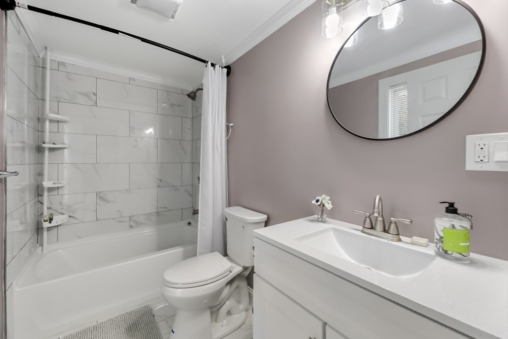 45 Forest Street Lee, MA 01238 - Photo 26 of 42 a bathroom with a sink a toilet and a mirror