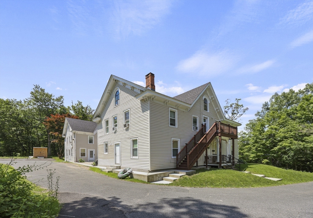 45 Forest Street Lee, MA 01238 - Photo 37 of 42 a front view of a house with a yard