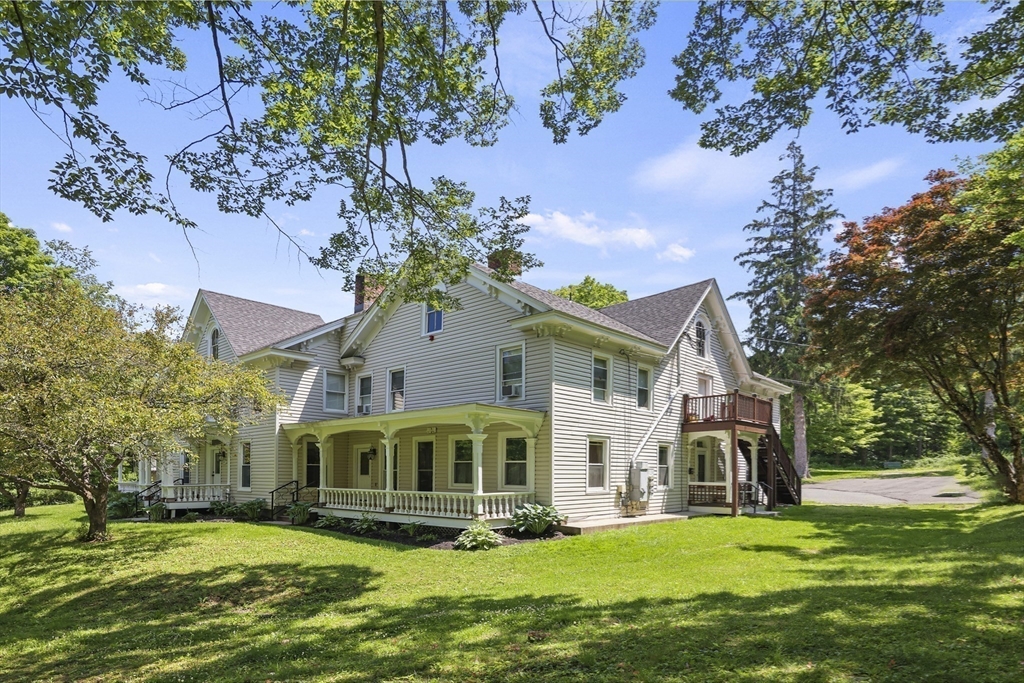 45 Forest Street Lee, MA 01238 - Photo 38 of 42 a front view of a house with a garden