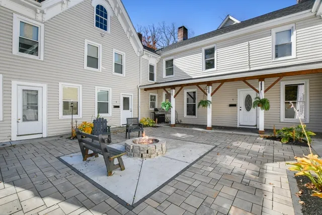 a view of a white house with swimming pool in front of it