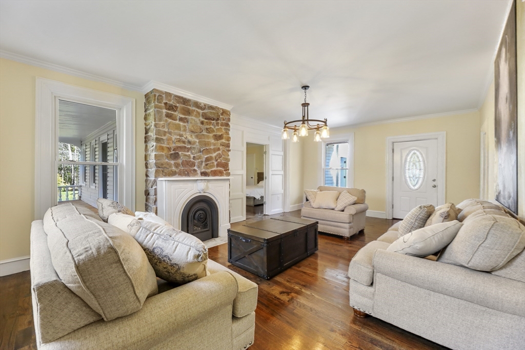 45 Forest Street Lee, MA 01238 - Photo 8 of 42 a living room with furniture and a fireplace