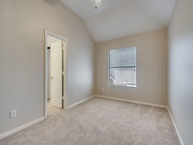 a view of room with window and closet area