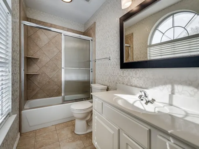 a bathroom with a sink a toilet and a bathtub