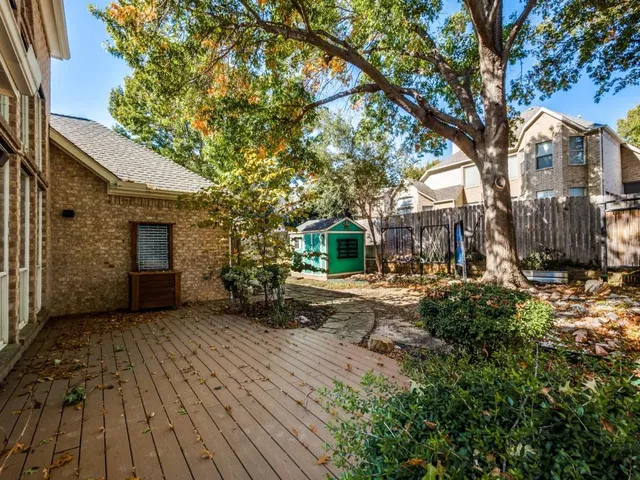 a view of a house with a tree