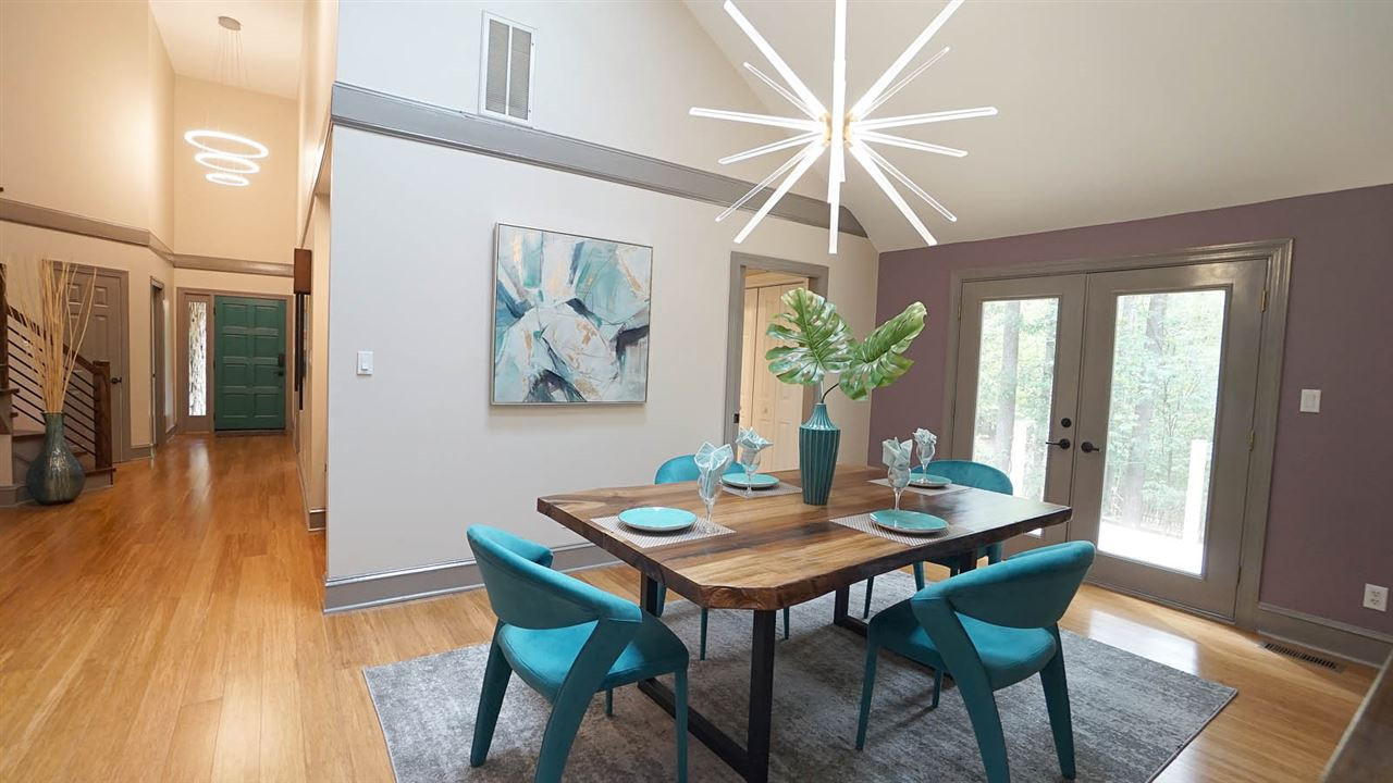 10517 Whitestone Road Raleigh, NC 27615 - Photo 4 of 30 Spacious dining room off kitchen has an exterior door that extends to a new deck area for easy access to grill and the deck also extends to the screened porch. Dining Room