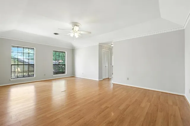 a bedroom with a bed and a night stand