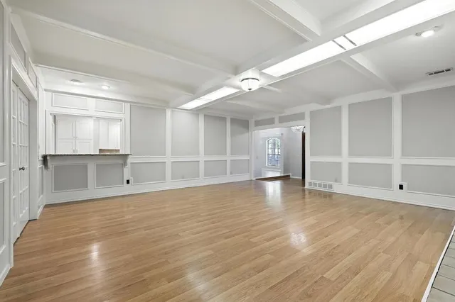 a view of a kitchen with a sink and dishwasher cabinets