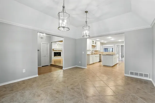 a kitchen with stainless steel appliances granite countertop a sink and cabinets