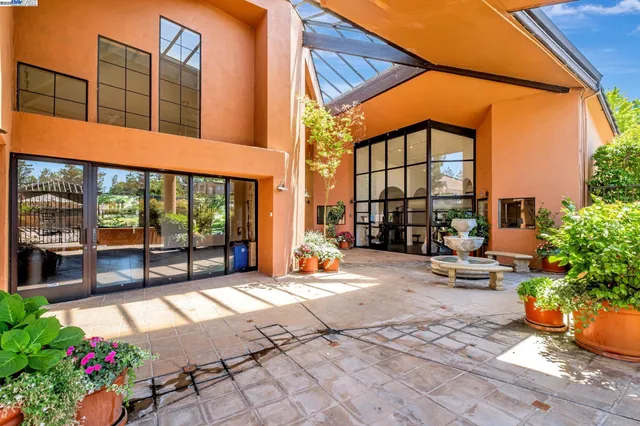 a view of a building with sitting area