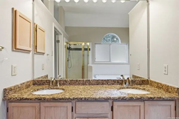 a white bath tub sitting next to a toilet