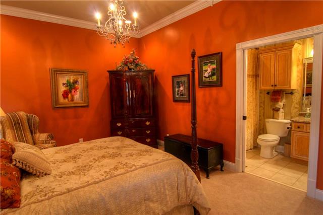2305 Armstrong Valley Road Murfreesboro, TN 37128 - Photo 12 of 27 a bedroom with a bed and a chandelier