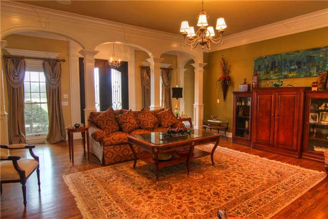 2305 Armstrong Valley Road Murfreesboro, TN 37128 - Photo 4 of 27 a living room with patio furniture and a chandelier