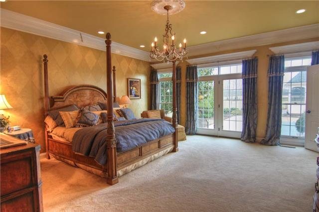2305 Armstrong Valley Road Murfreesboro, TN 37128 - Photo 6 of 27 a spacious bedroom with a bed a chandelier and large windows