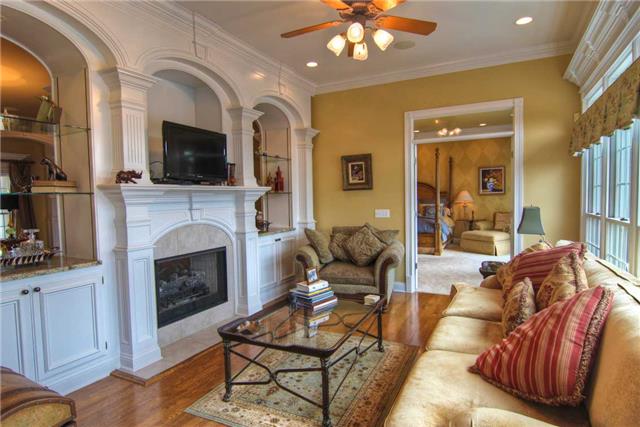 2305 Armstrong Valley Road Murfreesboro, TN 37128 - Photo 8 of 27 a living room with furniture a flat screen tv and a fireplace