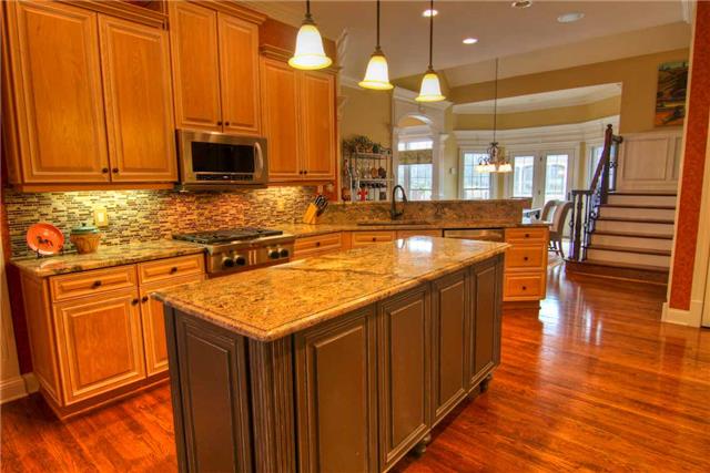 2305 Armstrong Valley Road Murfreesboro, TN 37128 - Photo 10 of 27 a kitchen with stainless steel appliances granite countertop a sink a stove top oven a chimney and a counter space