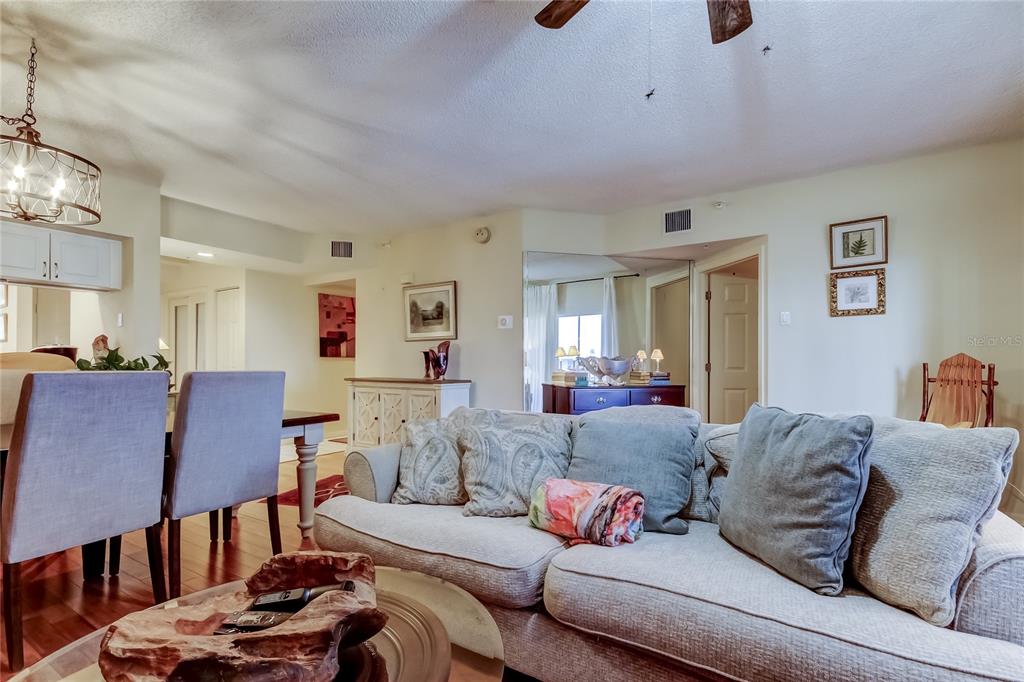 6205 Shoreline Drive, Unit 1304 Seminole, FL 33708 - Photo 20 of 57 a living room with furniture and a couch