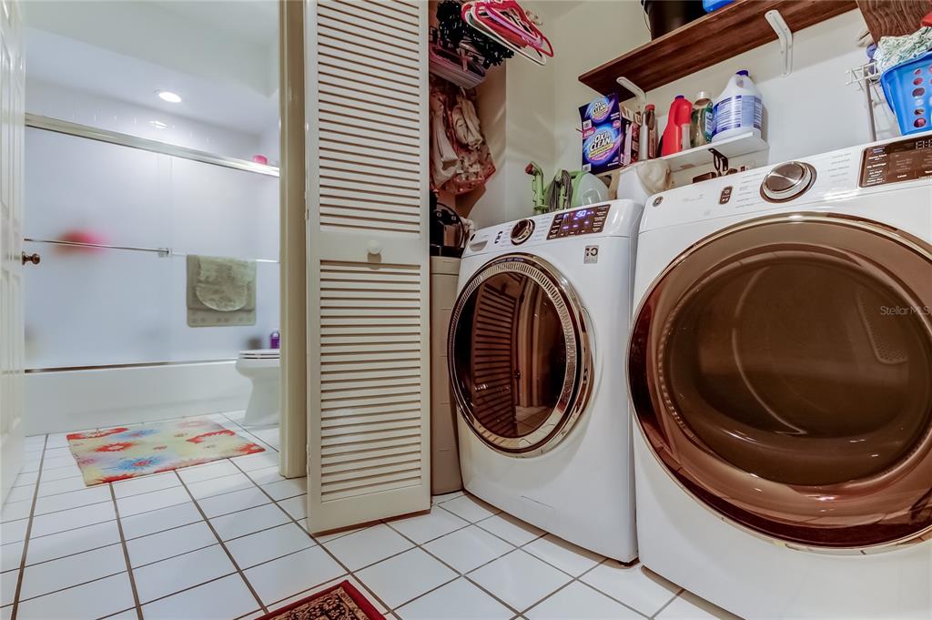 6205 Shoreline Drive, Unit 1304 Seminole, FL 33708 - Photo 34 of 57 a utility room with dryer and washer