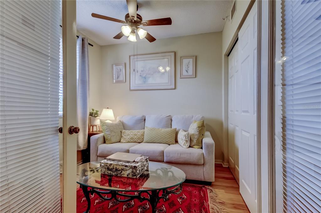 6205 Shoreline Drive, Unit 1304 Seminole, FL 33708 - Photo 36 of 57 a living room with furniture and a rug