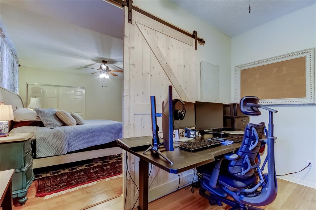 6205 Shoreline Drive, Unit 1304 Seminole, FL 33708 - Photo 38 of 57 a workspace with furniture and wooden floor