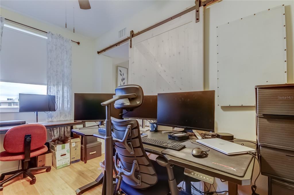 6205 Shoreline Drive, Unit 1304 Seminole, FL 33708 - Photo 40 of 57 a view of a workspace with furniture and a desk