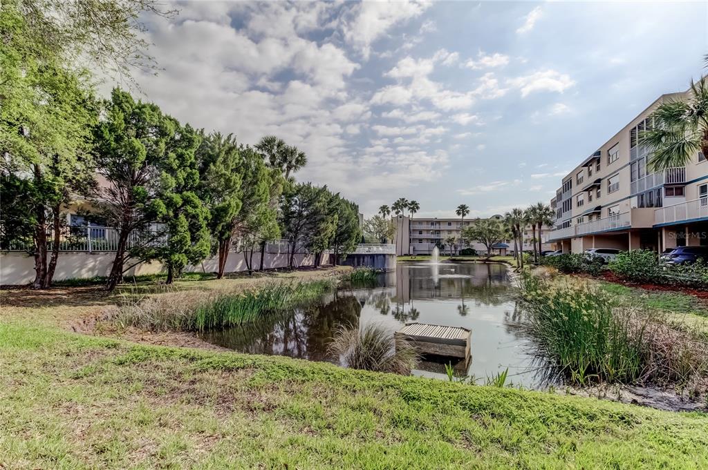 6205 Shoreline Drive, Unit 1304 Seminole, FL 33708 - Photo 53 of 57 a view of a garden with houses