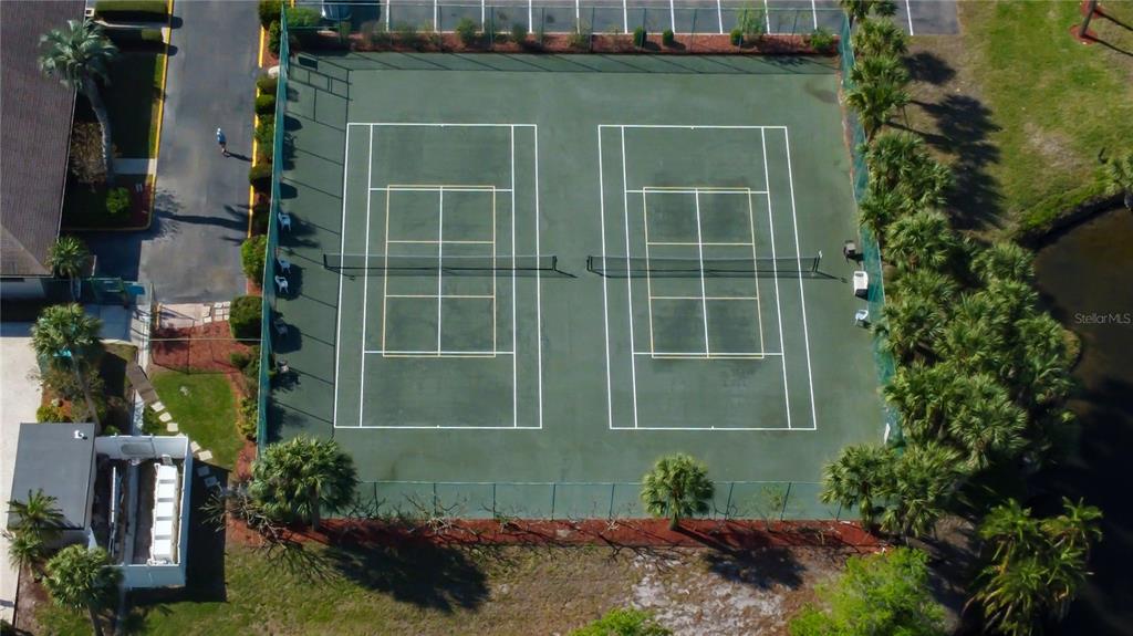 6205 Shoreline Drive, Unit 1304 Seminole, FL 33708 - Photo 54 of 57 a green field with some trees in front of it