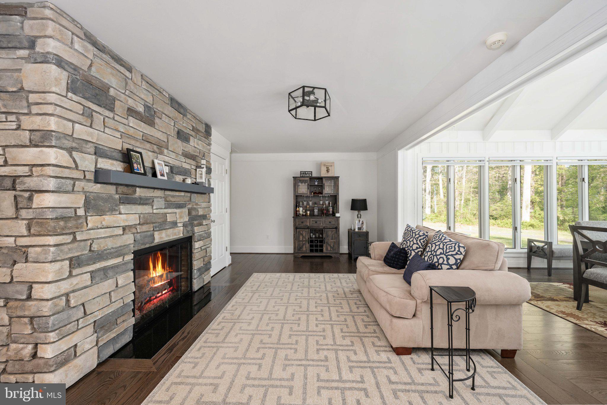 5699 Red Brick Road Warrenton, VA 20187 - Photo 18 of 35 Cozy living space with stone fireplace.