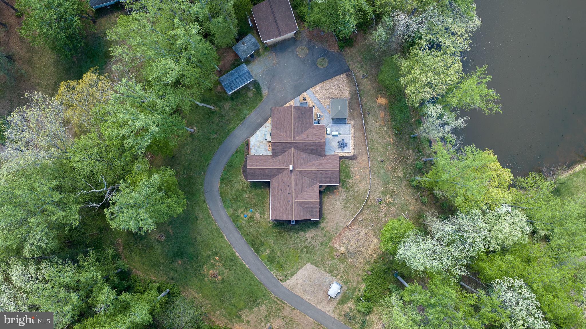 5699 Red Brick Road Warrenton, VA 20187 - Photo 34 of 35 Serene retreat nestled in lush greenery.