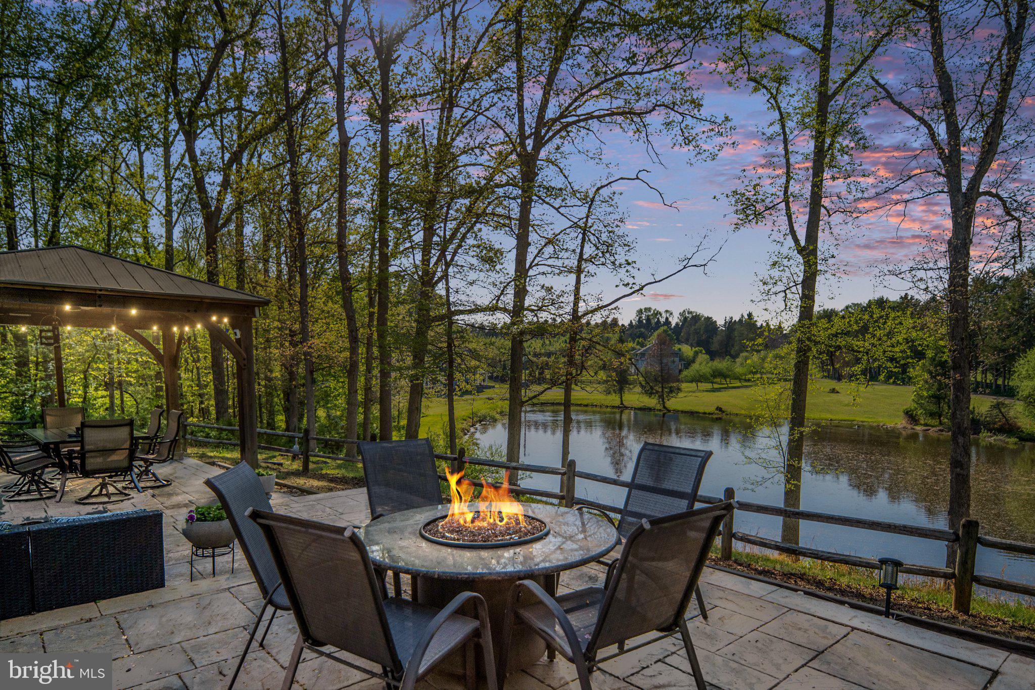 5699 Red Brick Road Warrenton, VA 20187 - Photo 6 of 35 Serene lakeside retreat at dusk.