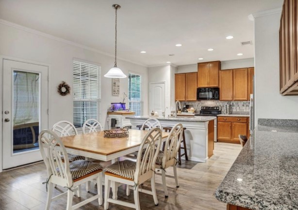 1428 Crested Butte Way Georgetown, TX 78626 - Photo 14 of 28 Dining space with ornamental molding, light wood-style floors, and recessed lighting