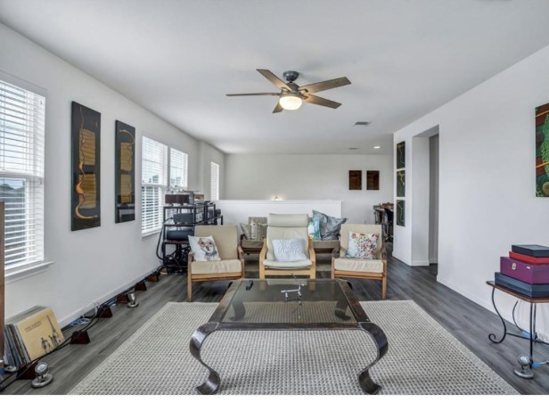 1428 Crested Butte Way Georgetown, TX 78626 - Photo 17 of 28 Living area with wood finished floors and a ceiling fan