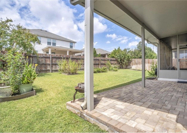 1428 Crested Butte Way Georgetown, TX 78626 - Photo 24 of 28 Fenced backyard with a patio area