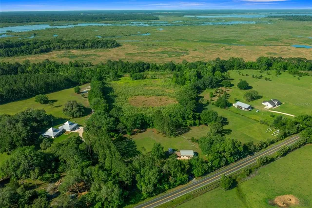 a view of a lake with a yard