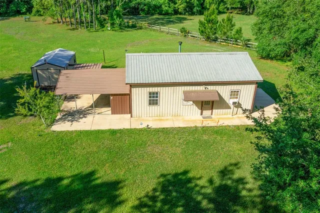 a view of a house with a yard porch and sitting area