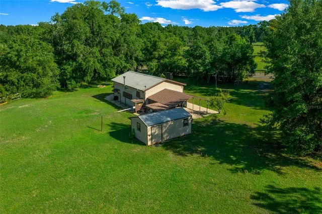 a aerial view of a house with a yard