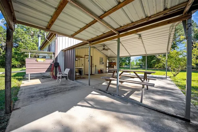 a view of a patio with a table chairs and a patio