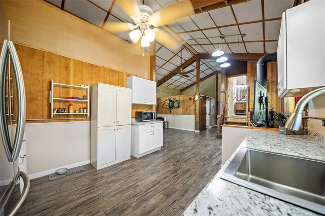 a kitchen with a refrigerator and a sink