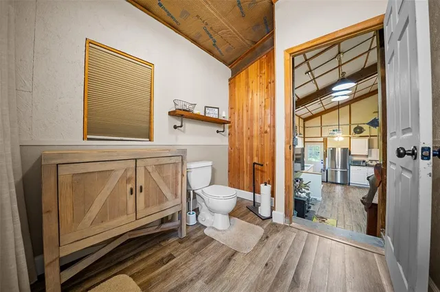 a bathroom with a toilet a sink and a shower