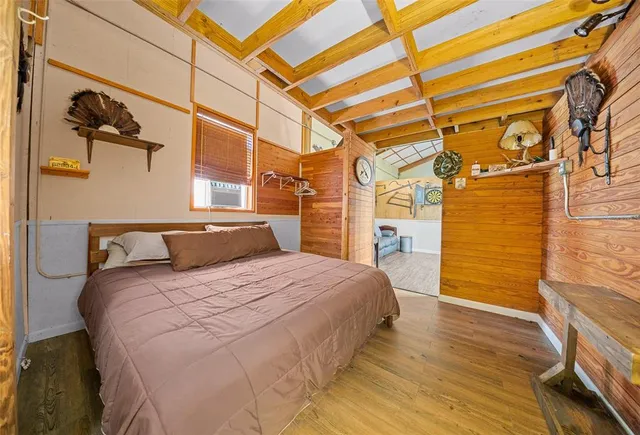 a bedroom with a bed and a walk in closet