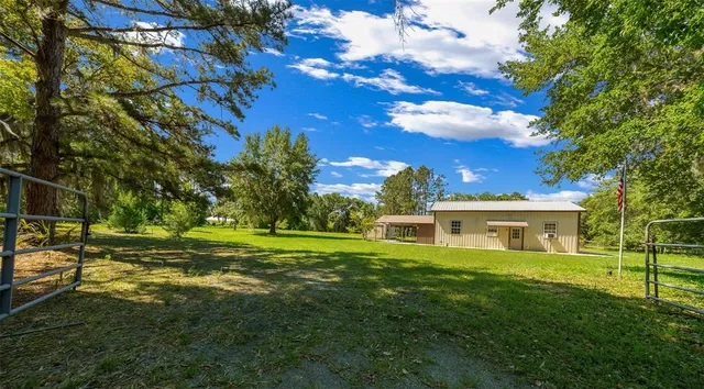 a view of a house with a big yard